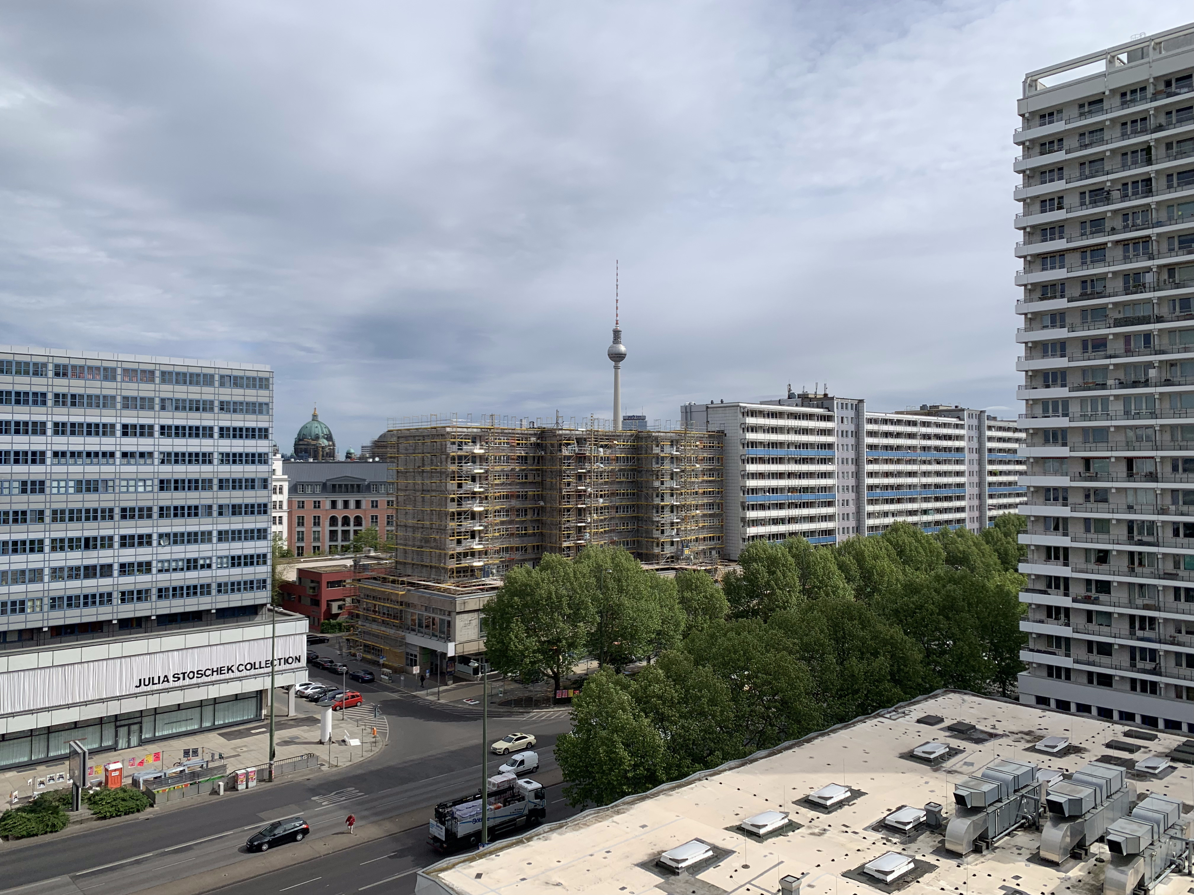 Open Forum Living 44 — balcony panorama with Fernsehturm, Berliner Dom, and neighbouring Plattenbau towers